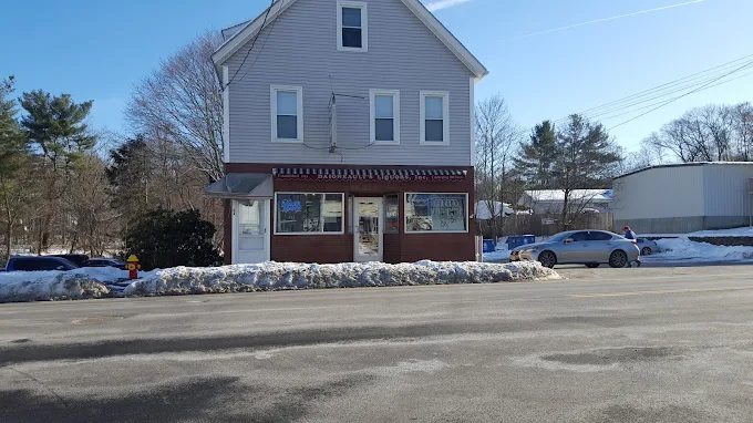 Historic Daigneault's Liquors storefront at 66 Broad Street in Hudson Massachusetts - neighborhood market since 1919