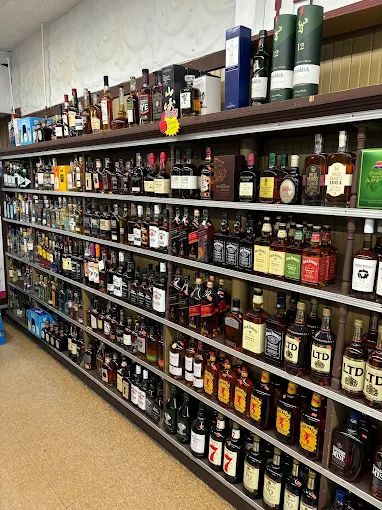 Whiskey and bourbon shelf selection at Thirst Quench Liquors in Hudson Massachusetts